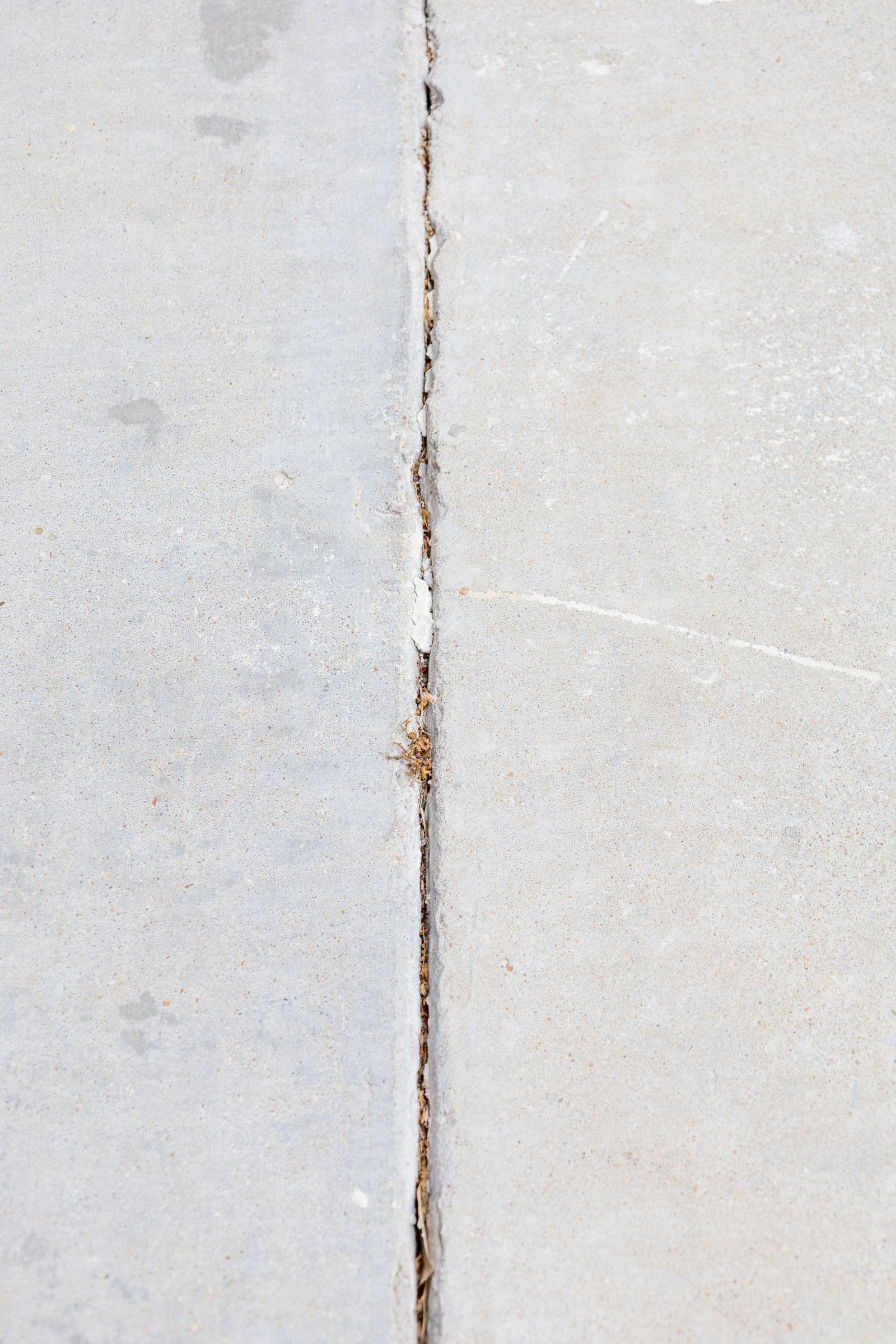 Concrete apron joining a driveway to the road